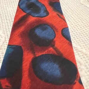 #748. Stringbeans Dark Red and Navy Tie with an abstract pattern.